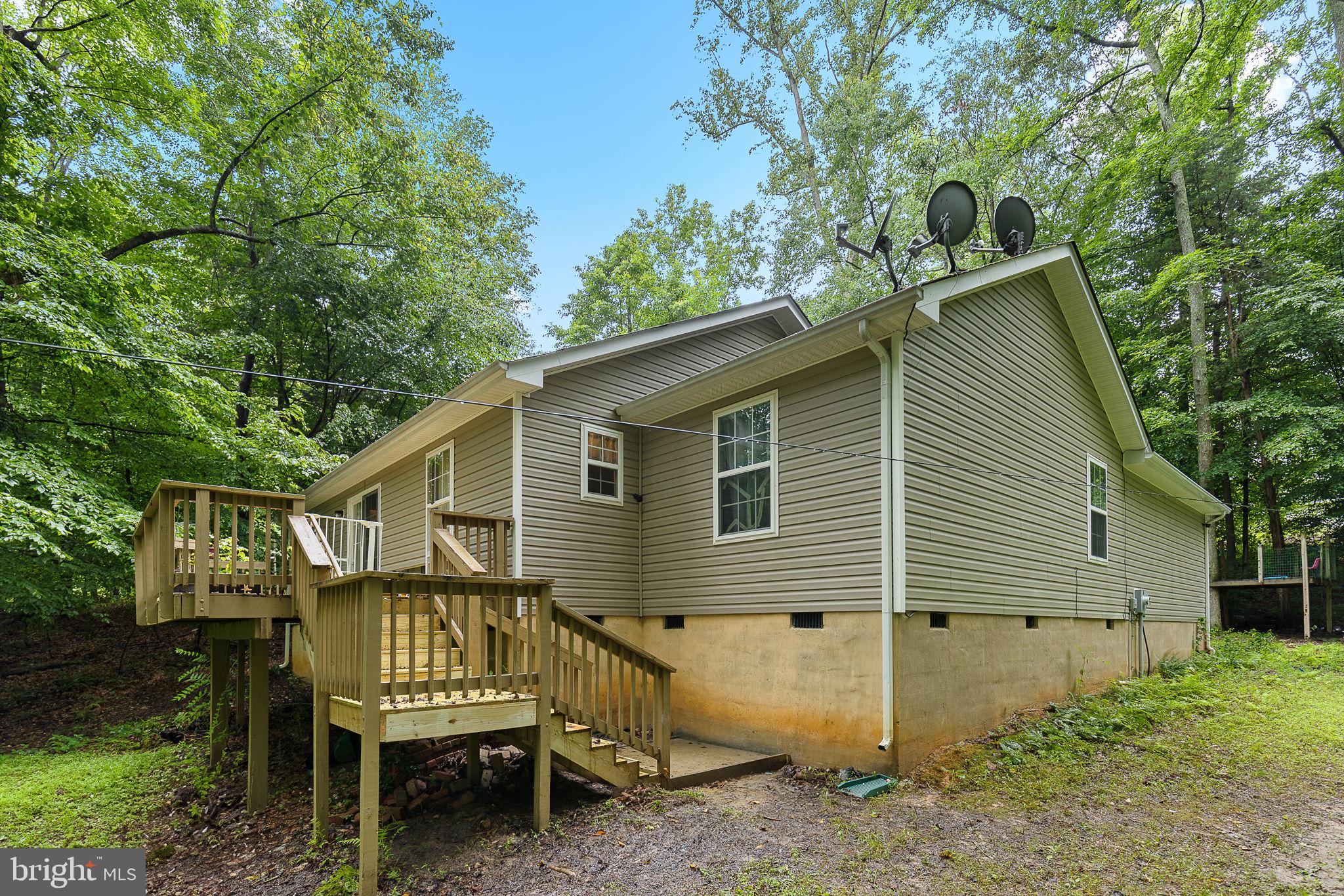 6199 Curtis Circle King George, VA 22485 - Photo 19 of 33 a backyard of a house with table and chairs