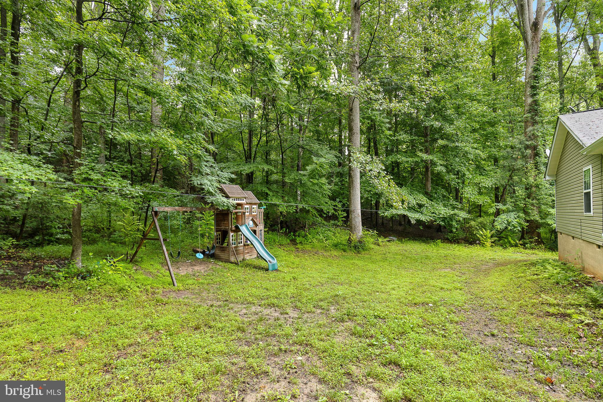 6199 Curtis Circle King George, VA 22485 - Photo 21 of 33 a view of a backyard with a slide