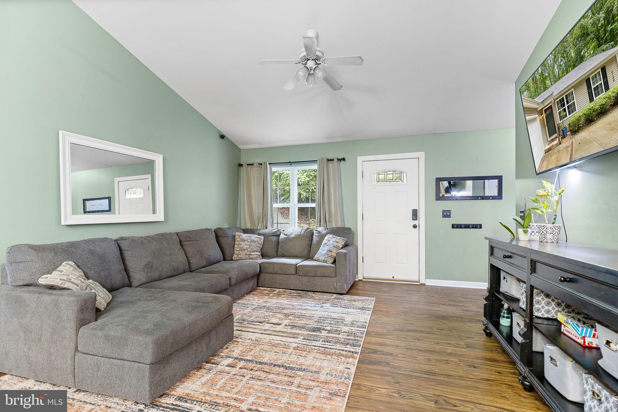 6199 Curtis Circle King George, VA 22485 - Photo 5 of 33 a living room with furniture and a wooden floor