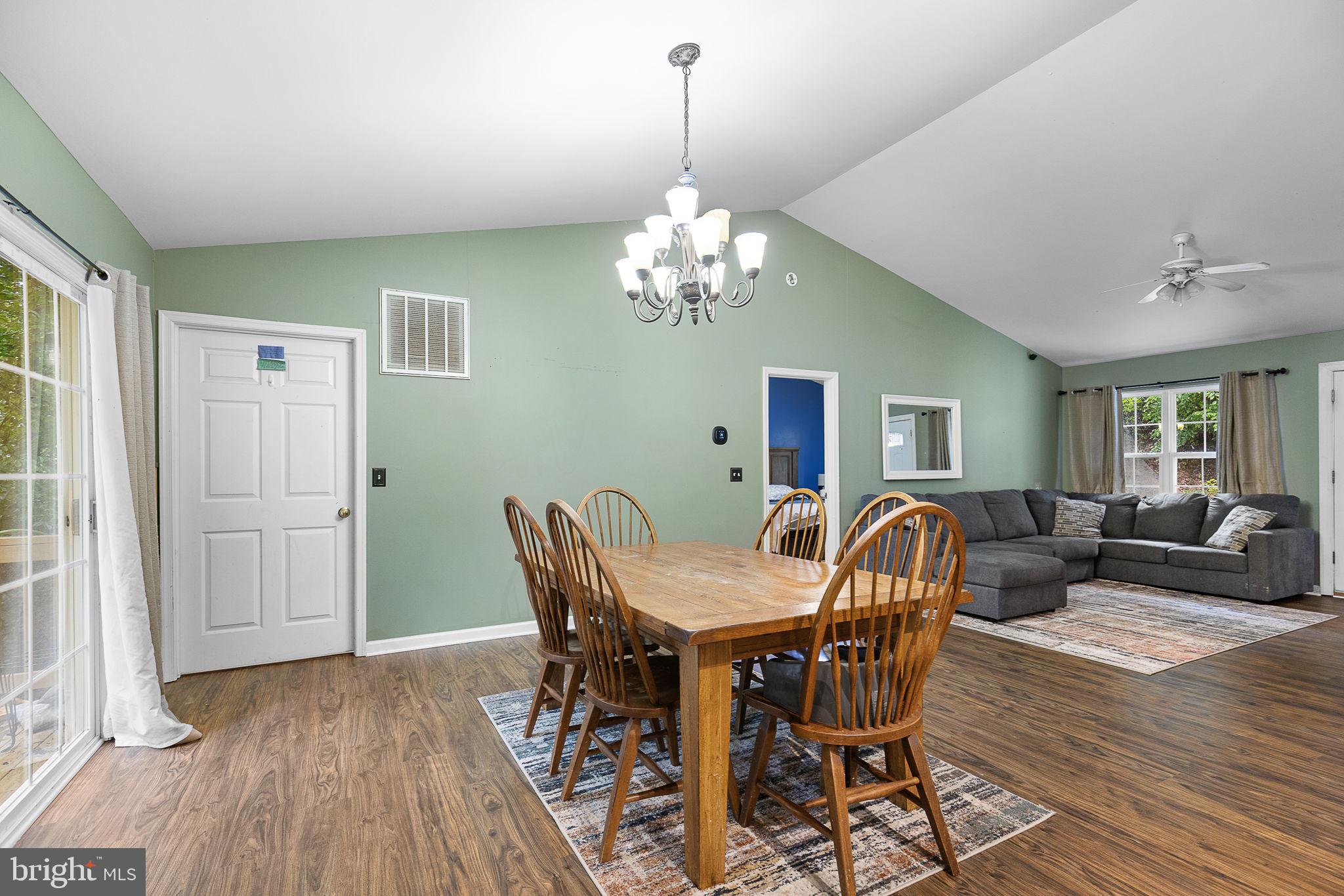 6199 Curtis Circle King George, VA 22485 - Photo 6 of 33 a view of a dining room with furniture wooden floor and chandelier