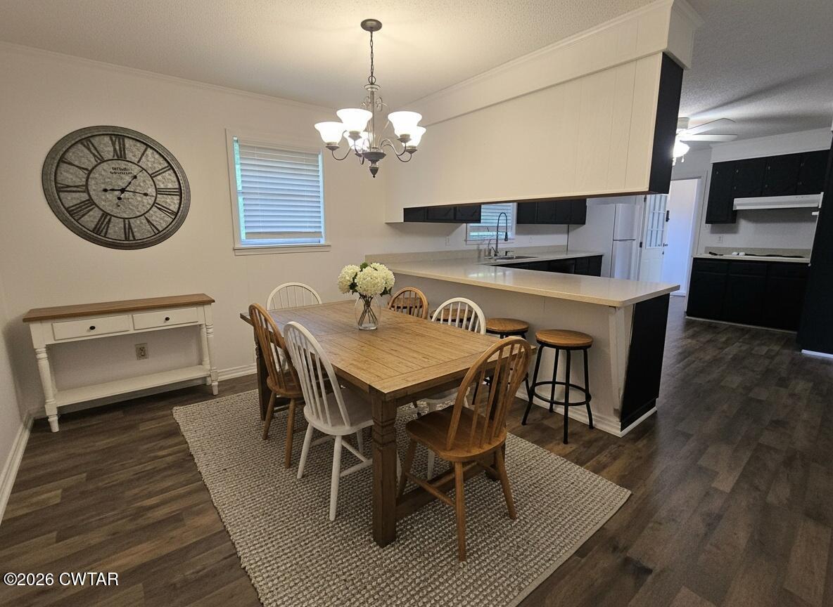 513 Viar Road Dyersburg, TN 38024 - Photo 13 of 37 a view of a dining room with furniture and wooden floor