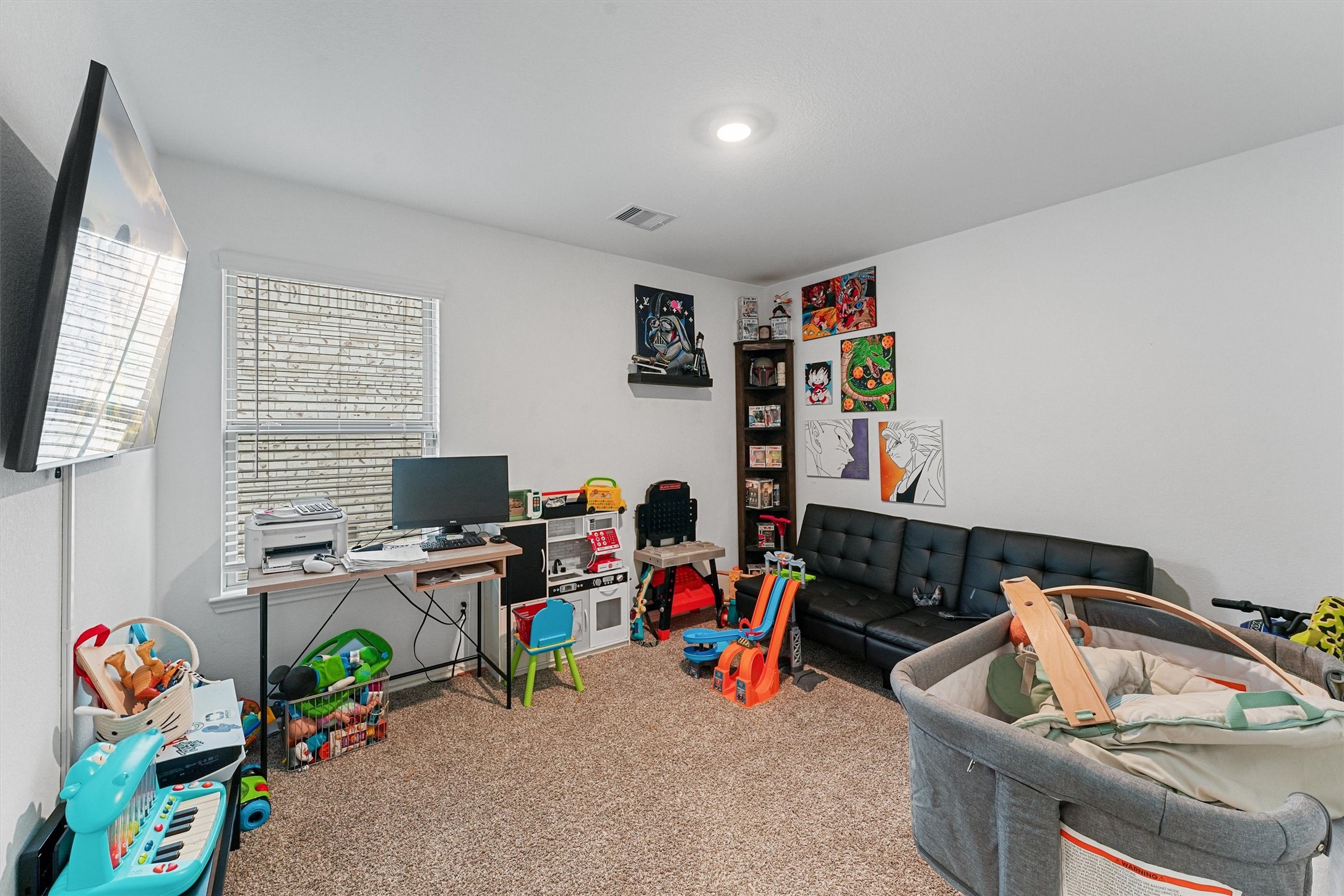 22411 Gilded Peak Lane Spring, TX 77373 - Photo 11 of 16 a room with furniture a rug toys and a window