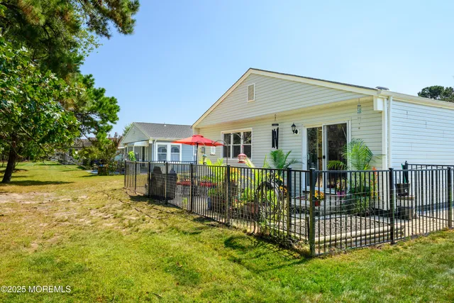 a view of a wrought iron fences in front of house