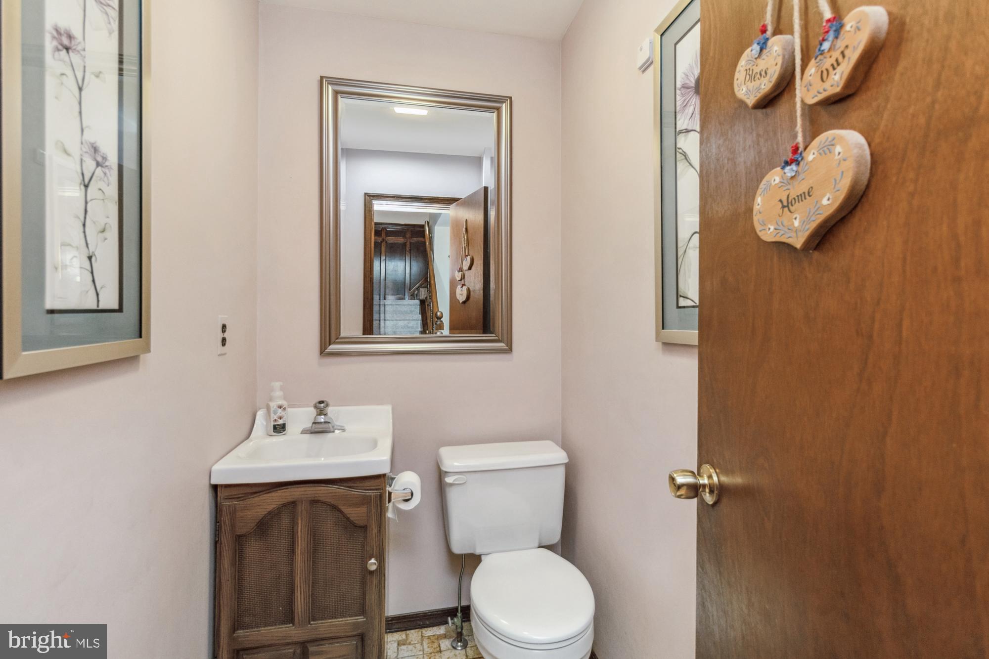 6004 Shady Spring Avenue Rosedale, MD 21237 - Photo 5 of 39 Half bath on main level