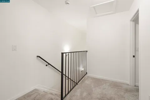 a view of a hallway with white walls