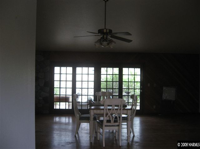 5700 Rebel Cause Road, Unit 1 Reno, NV 89510 - Photo 5 of 7 a view of a dining room with furniture window and wooden floor