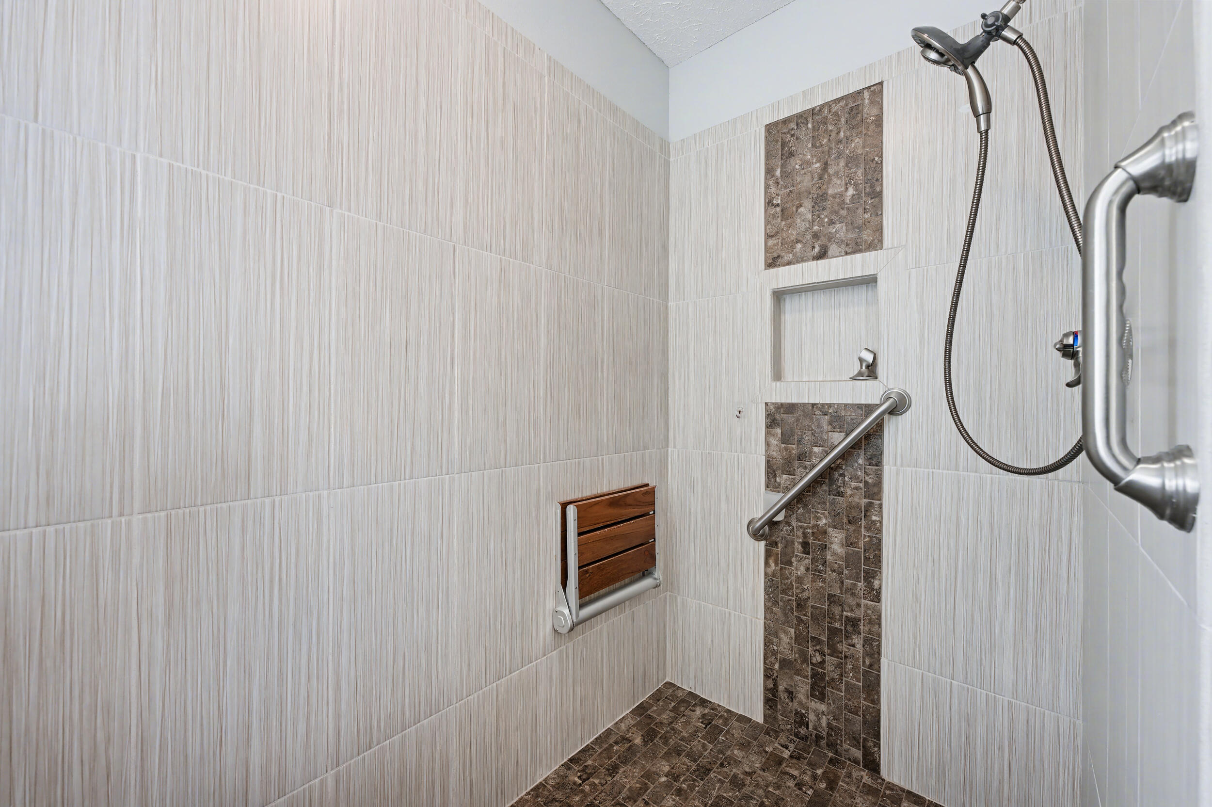 5127 Brookside Drive Pace, FL 32571 - Photo 11 of 25 a bathroom with a shower curtain and a window