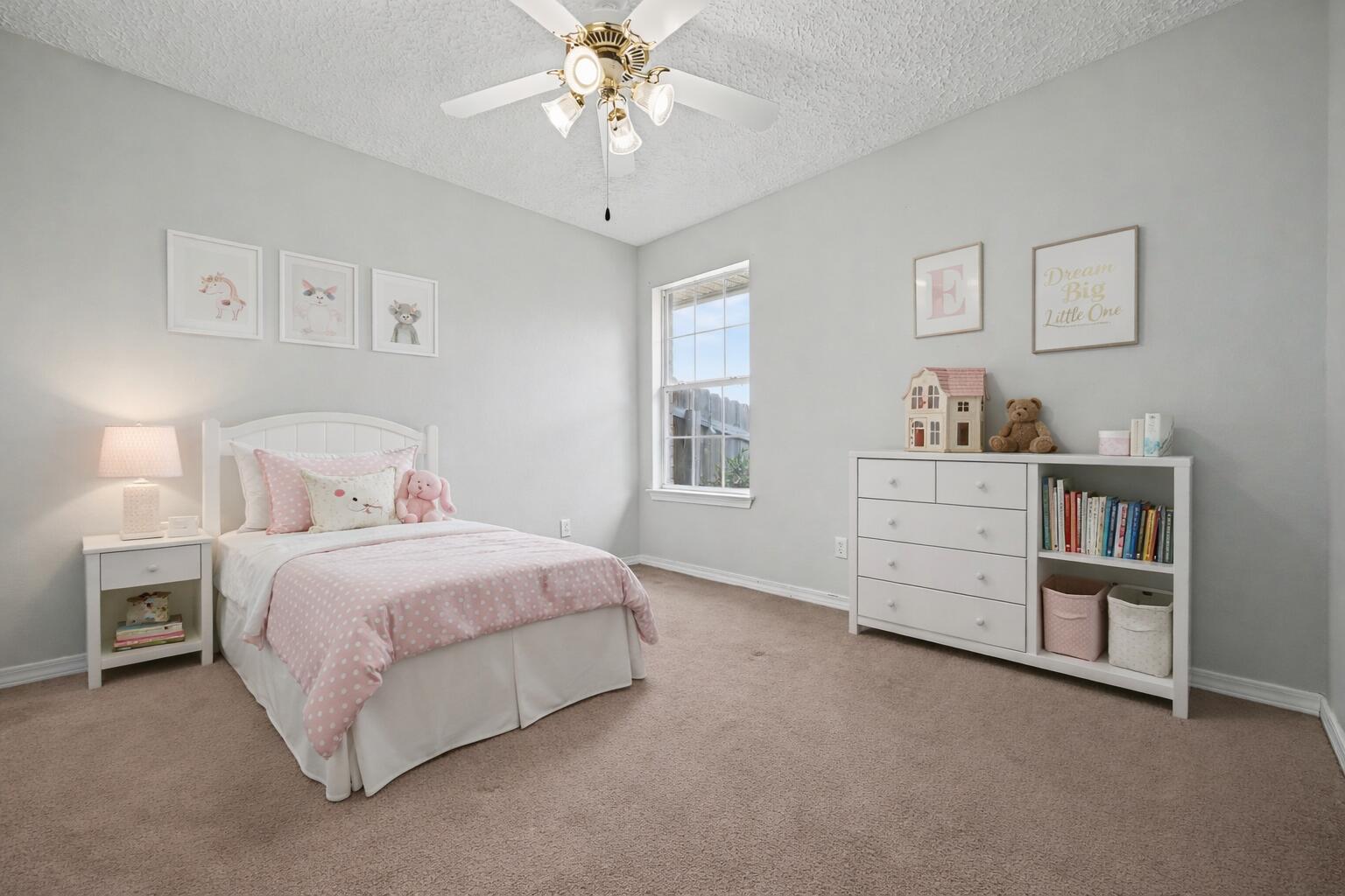 5127 Brookside Drive Pace, FL 32571 - Photo 16 of 25 a bedroom with a bed and a book shelf