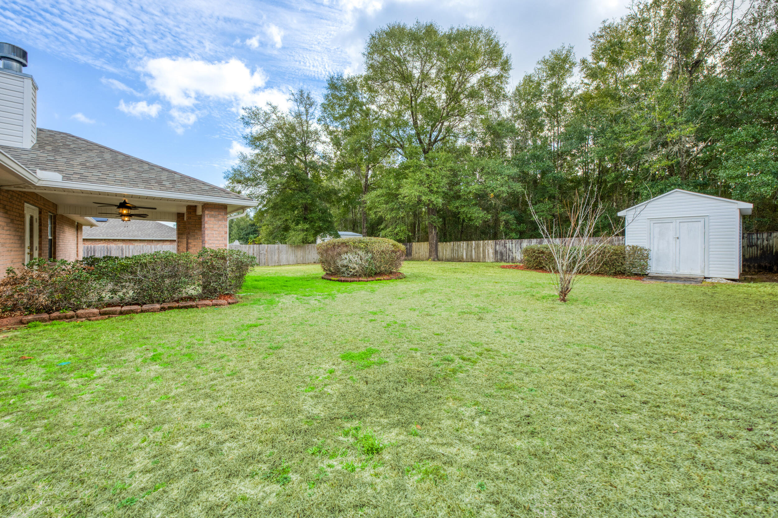 5127 Brookside Drive Pace, FL 32571 - Photo 22 of 25 a house view with a garden space