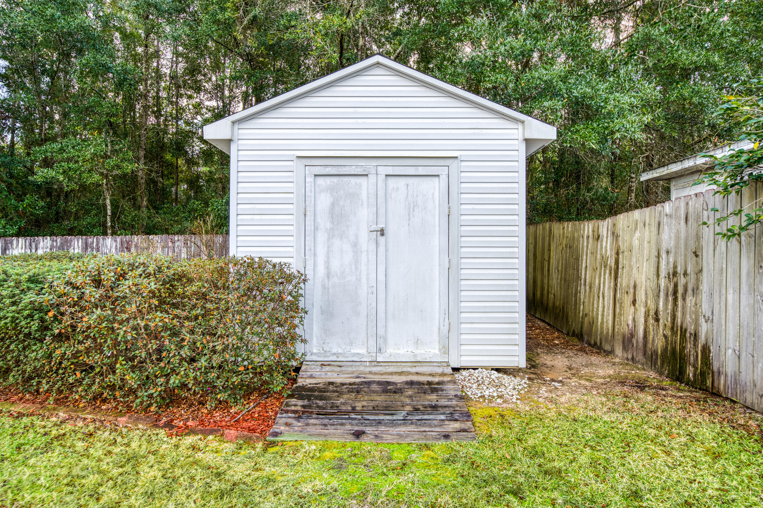 5127 Brookside Drive Pace, FL 32571 - Photo 24 of 25 a view of a house with a yard and garage