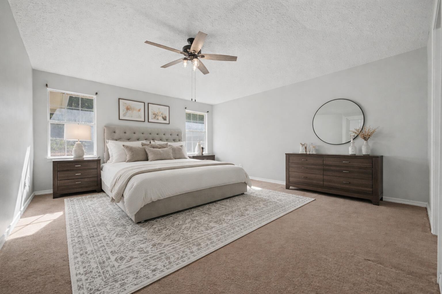 5127 Brookside Drive Pace, FL 32571 - Photo 8 of 25 a bedroom with a bed dresser and a window