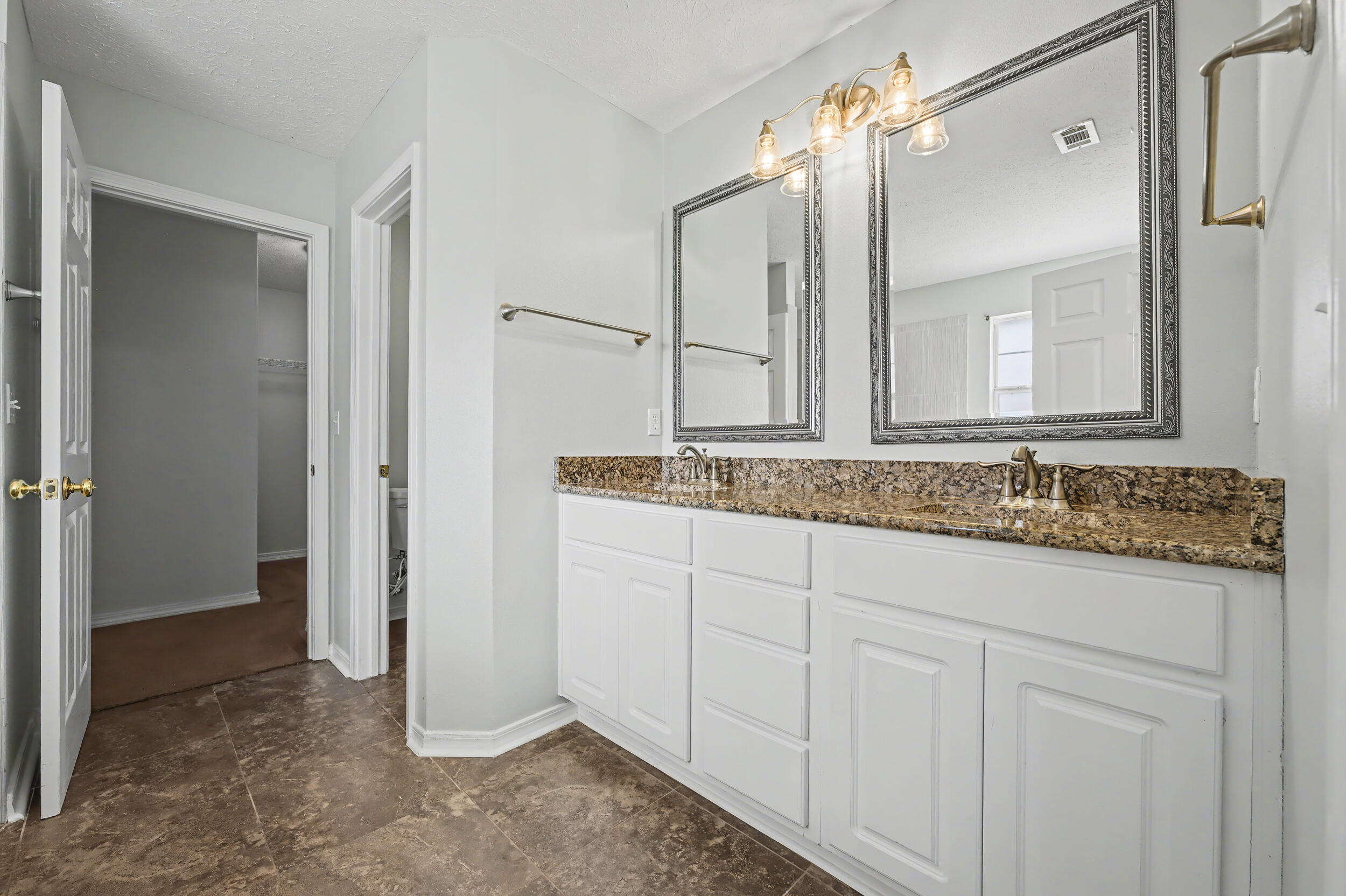 5127 Brookside Drive Pace, FL 32571 - Photo 9 of 25 a bathroom with a granite countertop sink and a mirror