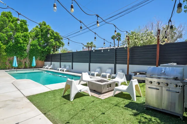 a view of a backyard with sitting area