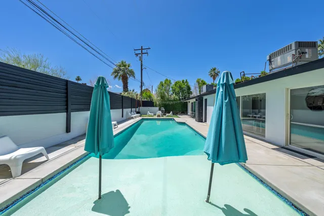 a view of a park with iron fence