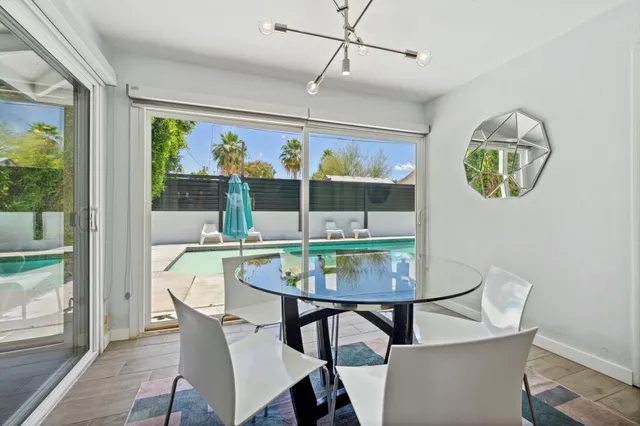 a view of a dining room with furniture window and outside view