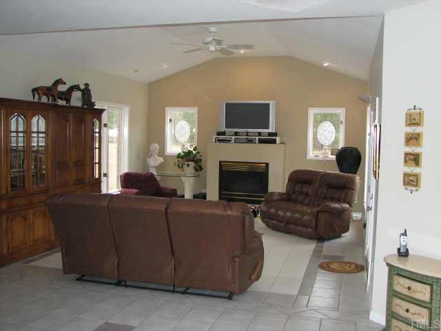 794 New Creech Road Selma, NC 27576 - Photo 3 of 10 Spacious Family Room with vaulted ceiling, gas logs fireplace, TV area over fireplace. Other