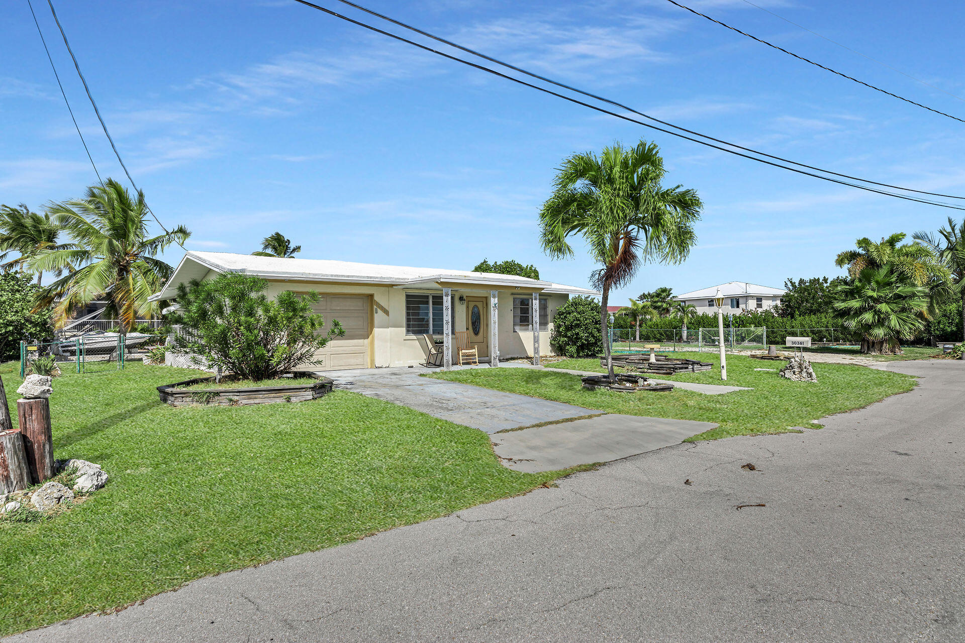 30361 Harding Road Big Pine Key, FL 33043 - Photo 1 of 33 a view of a house with backyard and a tree