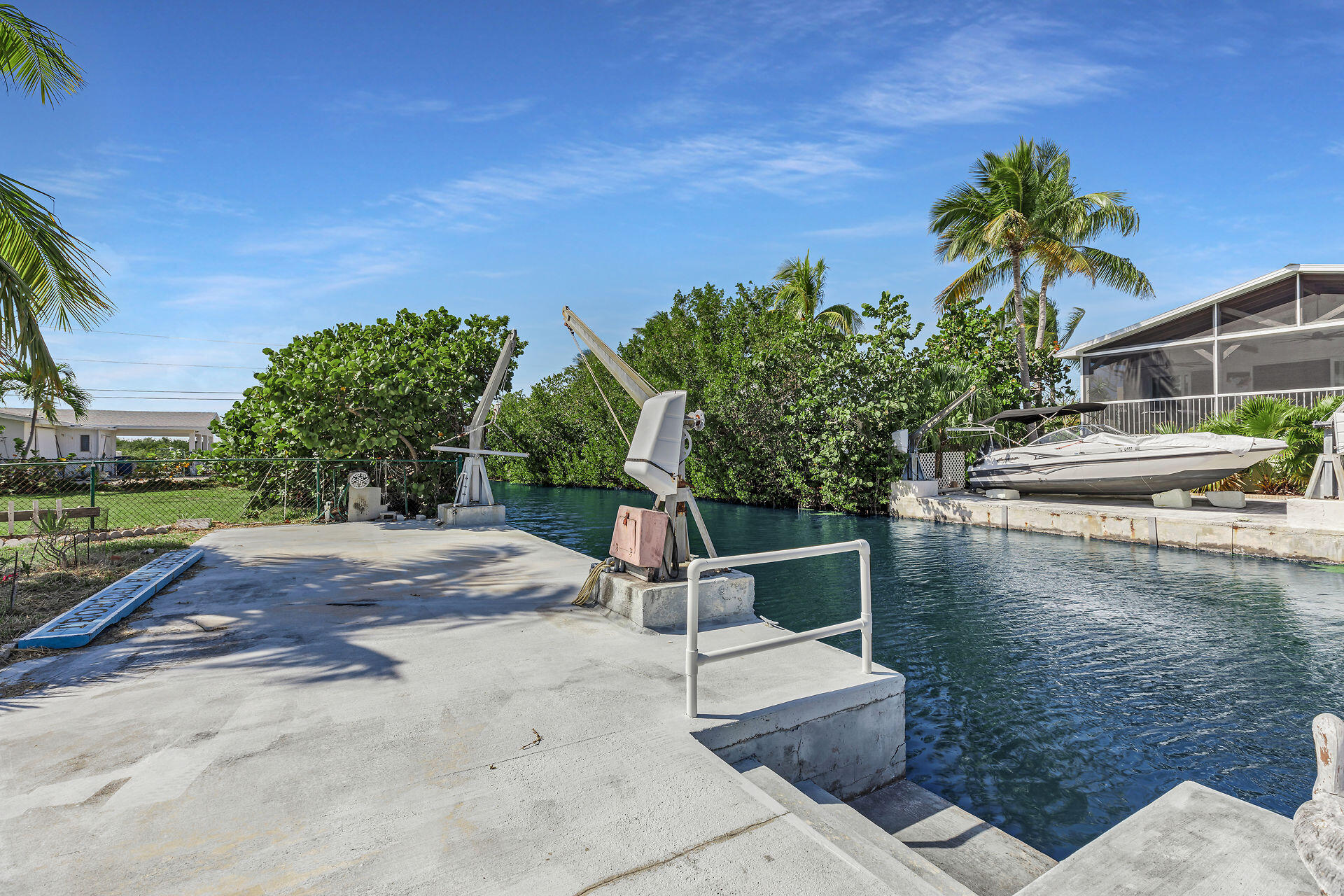 30361 Harding Road Big Pine Key, FL 33043 - Photo 11 of 33 a view of a lake with couches and wooden fence