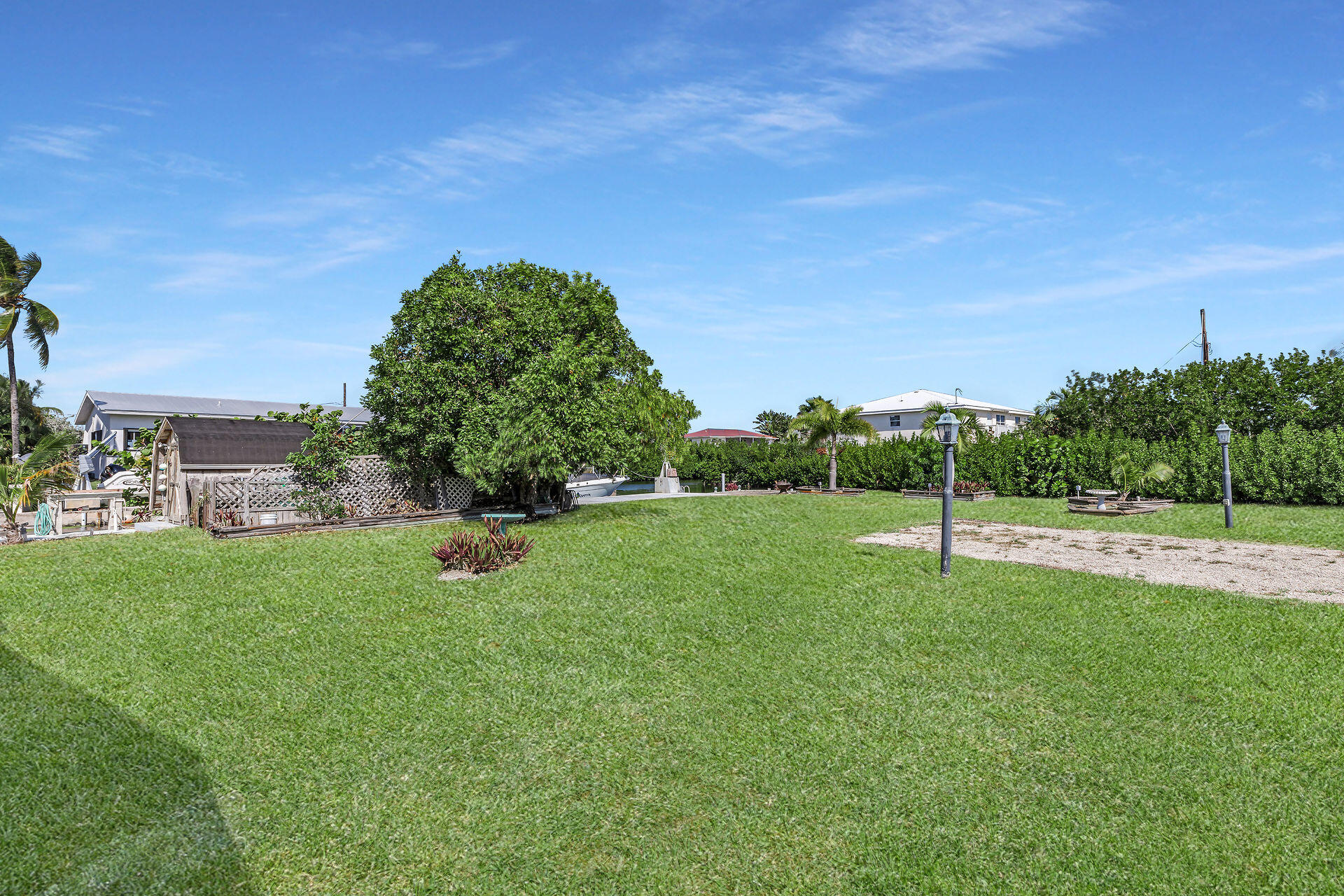 30361 Harding Road Big Pine Key, FL 33043 - Photo 16 of 33 a backyard of a house with lots of green space