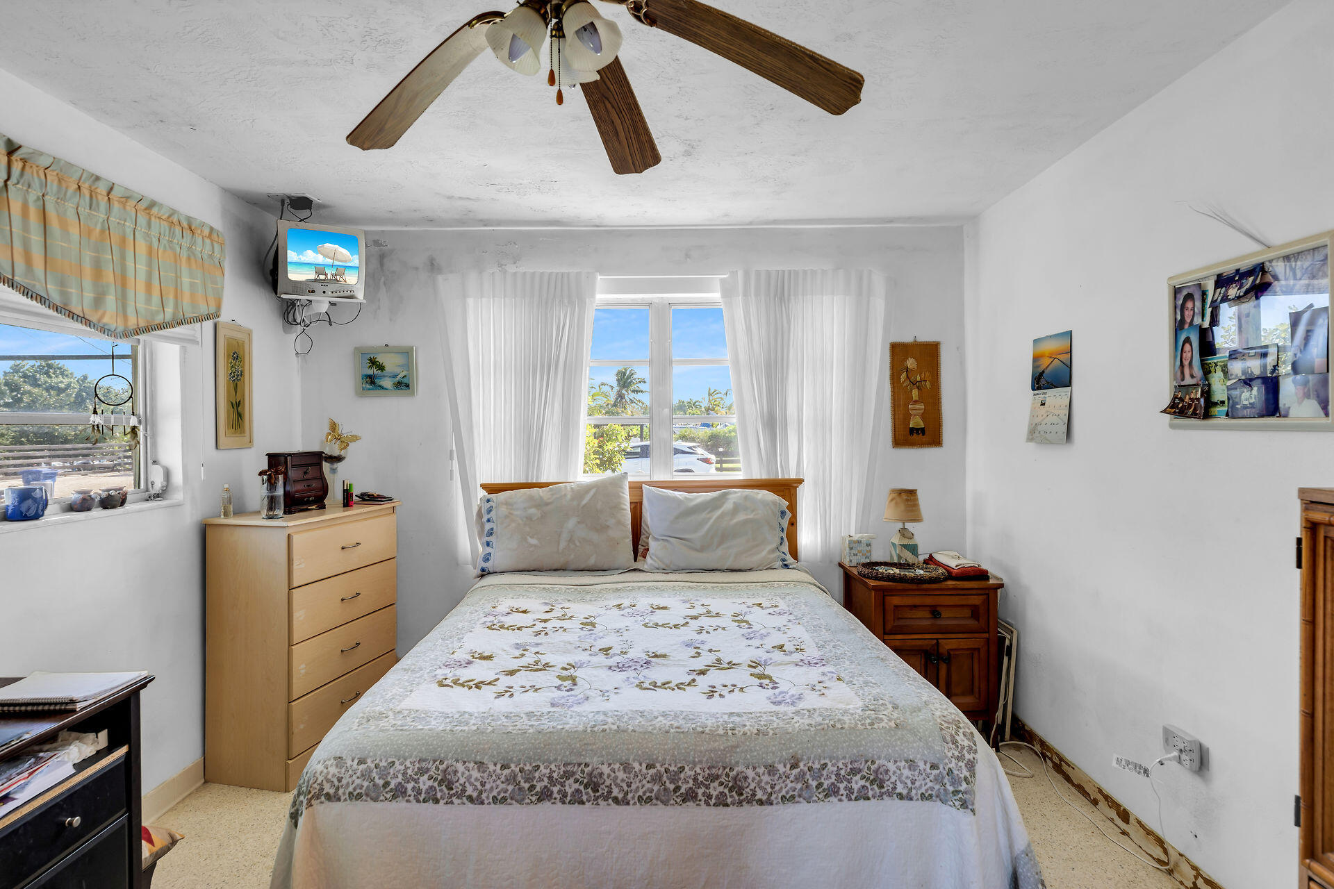 30361 Harding Road Big Pine Key, FL 33043 - Photo 25 of 33 a bedroom with a large bed and a window