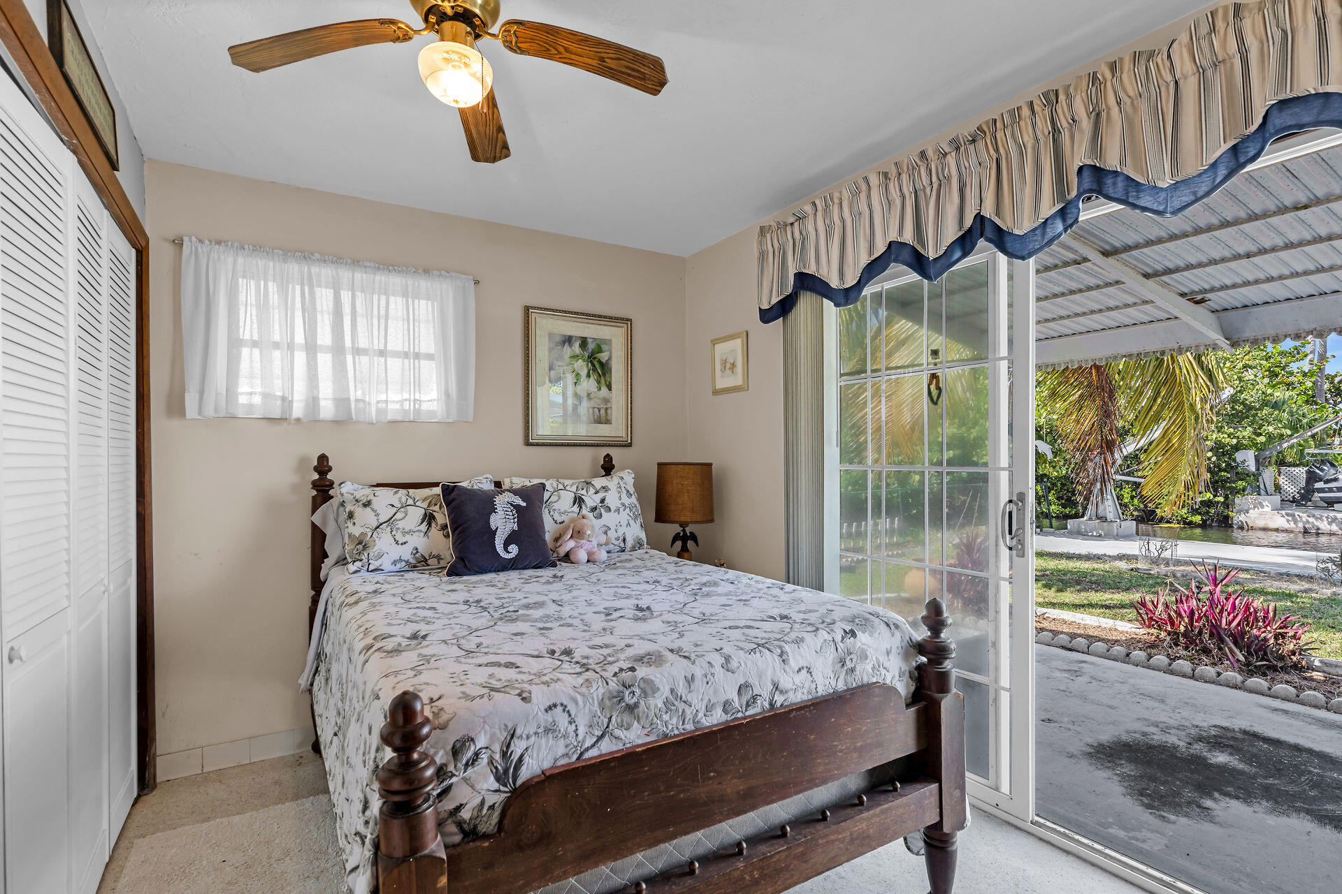 30361 Harding Road Big Pine Key, FL 33043 - Photo 27 of 33 a bedroom with a bed and a window