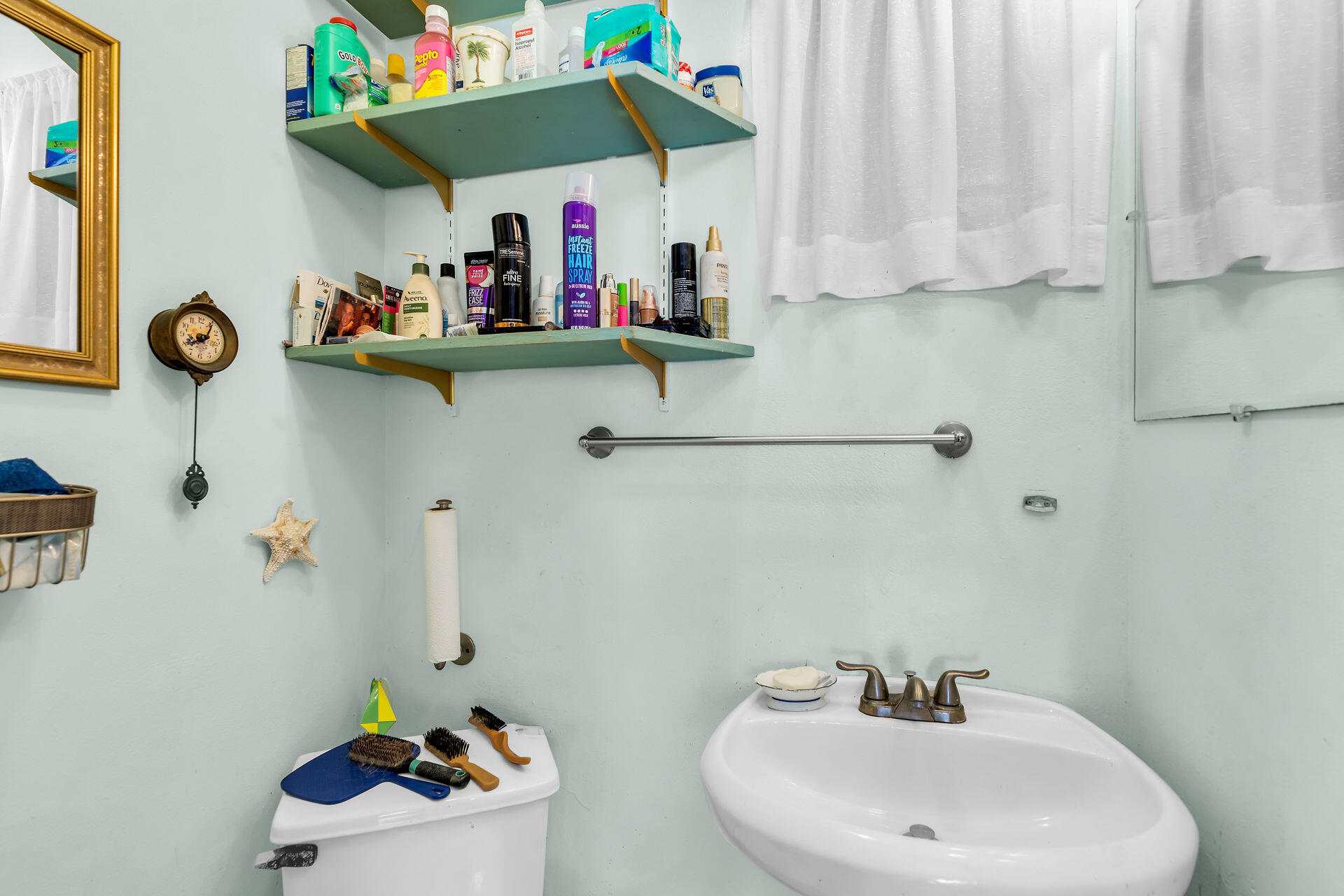 30361 Harding Road Big Pine Key, FL 33043 - Photo 29 of 33 a bathroom with a sink and a mirror
