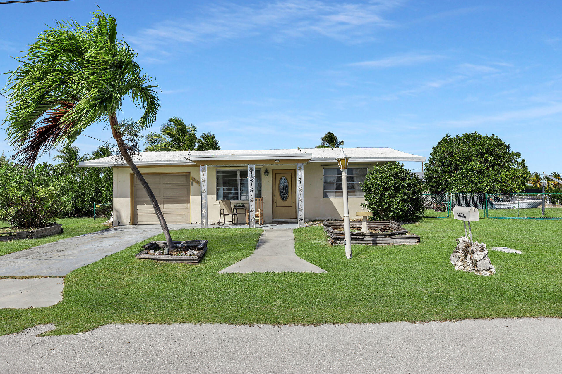 30361 Harding Road Big Pine Key, FL 33043 - Photo 33 of 33 a view of a house with backyard sitting area and garden