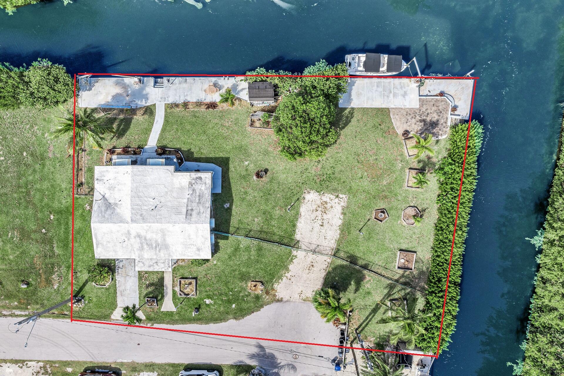 30361 Harding Road Big Pine Key, FL 33043 - Photo 4 of 33 an aerial view of a house with a yard and lake view