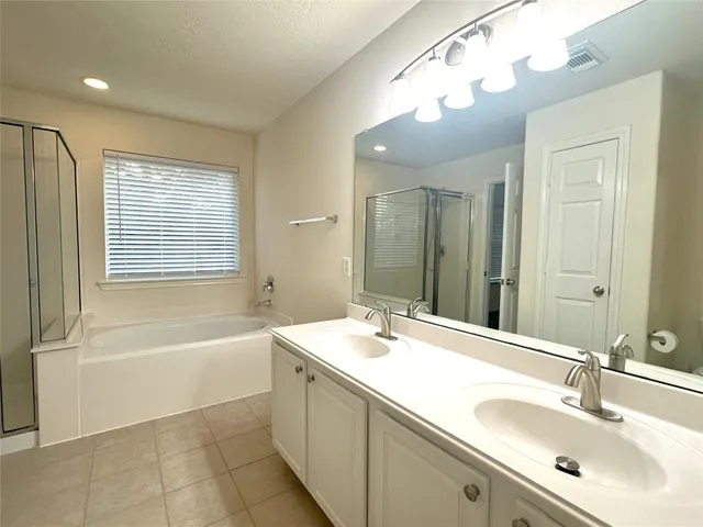 a view of an empty walk in closet with empty room