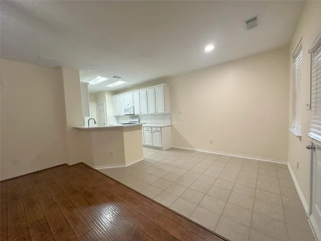 an empty room with wooden floor
