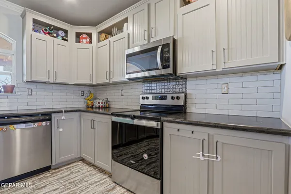 a living room with fireplace furniture and a wooden floor
