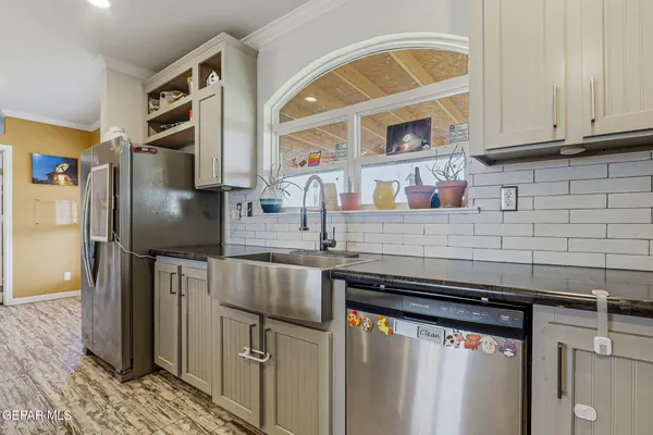 a view of a dining room with furniture and chandelier