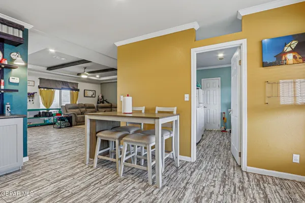 a living room with furniture and a book shelf