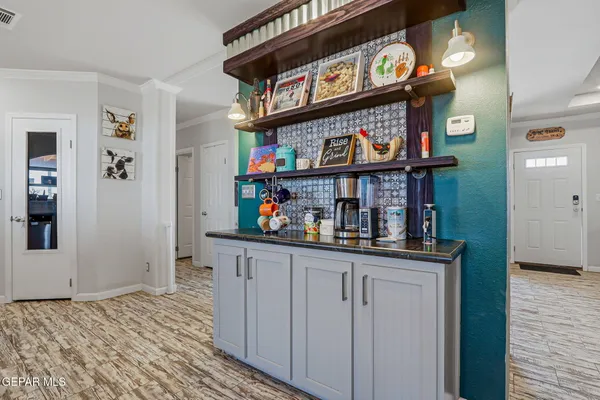a view of a dining room with furniture and a window