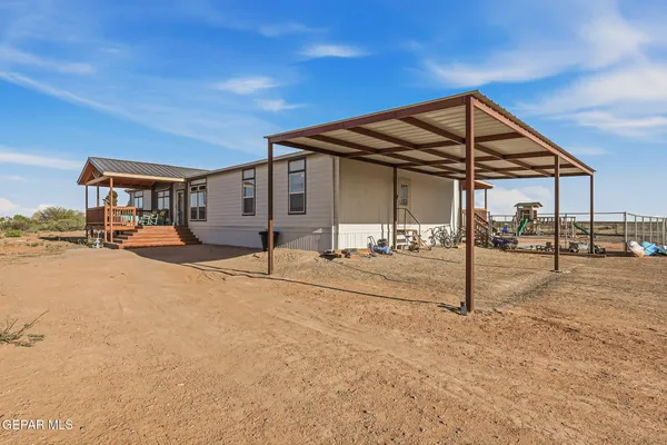 a kitchen with stainless steel appliances granite countertop a sink and a refrigerator