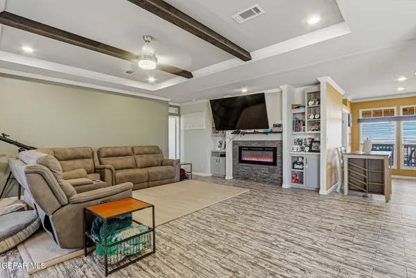 a bathroom with a granite countertop sink mirror vanity and toilet