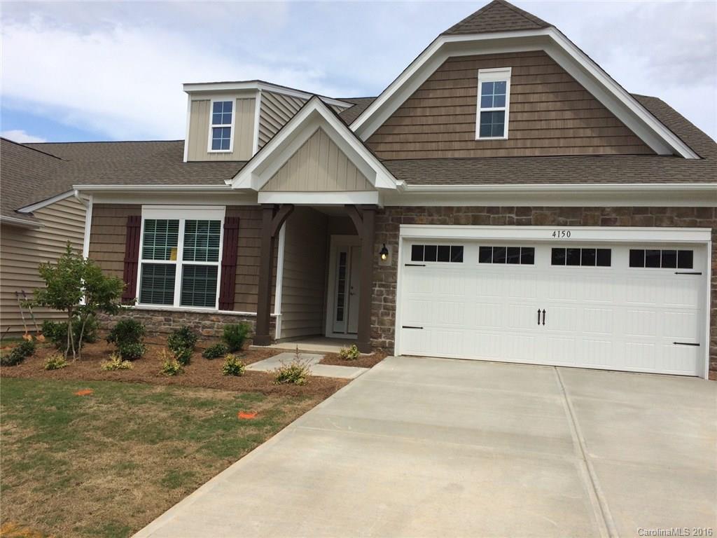 4150 Perth Road, Unit 247 Indian Land, SC 29707 - Photo 1 of 3 a front view of a house with a yard