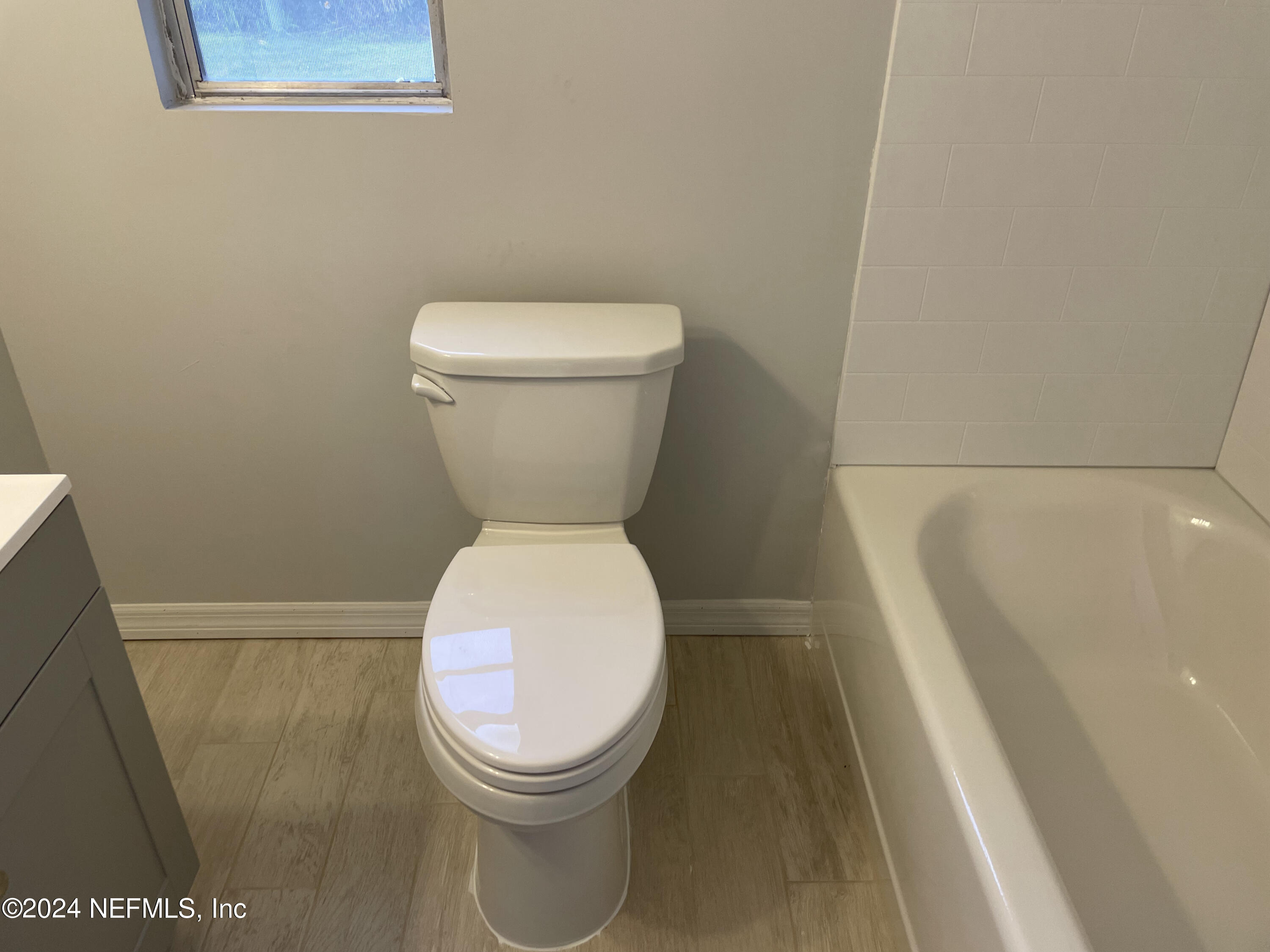 440 Sargo Road Atlantic Beach, FL 32233 - Photo 6 of 15 a white toilet sitting next to a shower