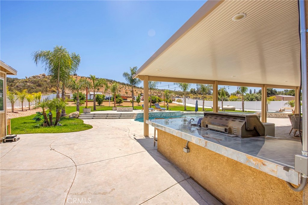 32797 Hayden Road Menifee, CA 92584 - Photo 34 of 51 a view of swimming pool with outdoor seating and a ocean view