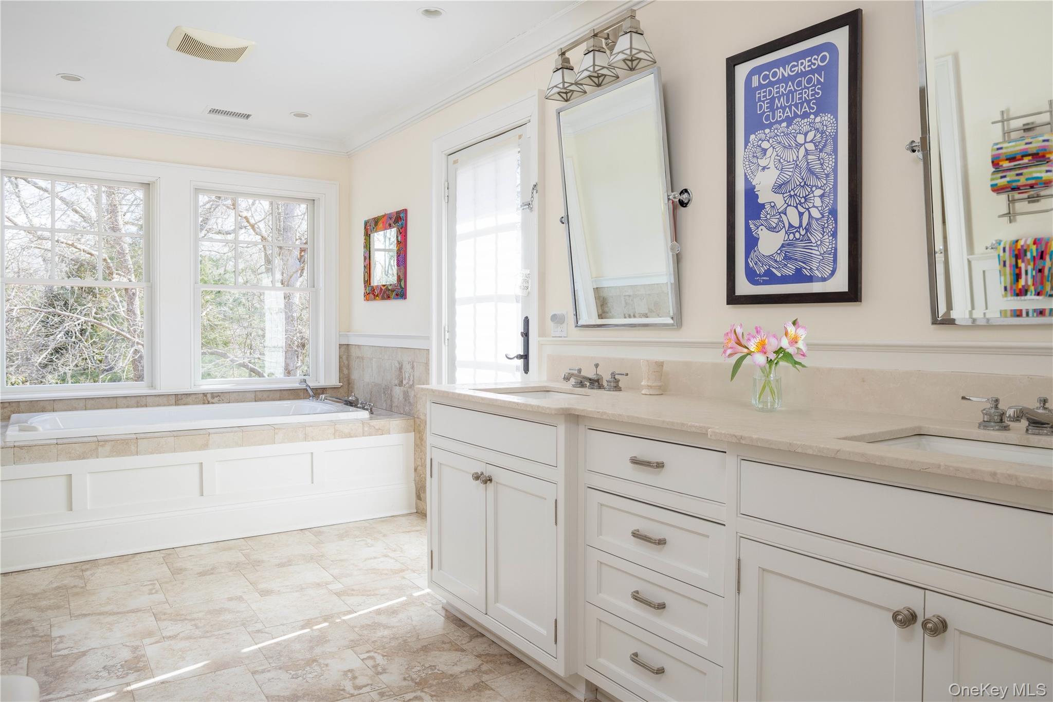 53 Cedar Lane West Remsenburg, NY 11960 - Photo 32 of 38 Full bath with double vanity, a sink, a healthy amount of sunlight, and ornamental molding