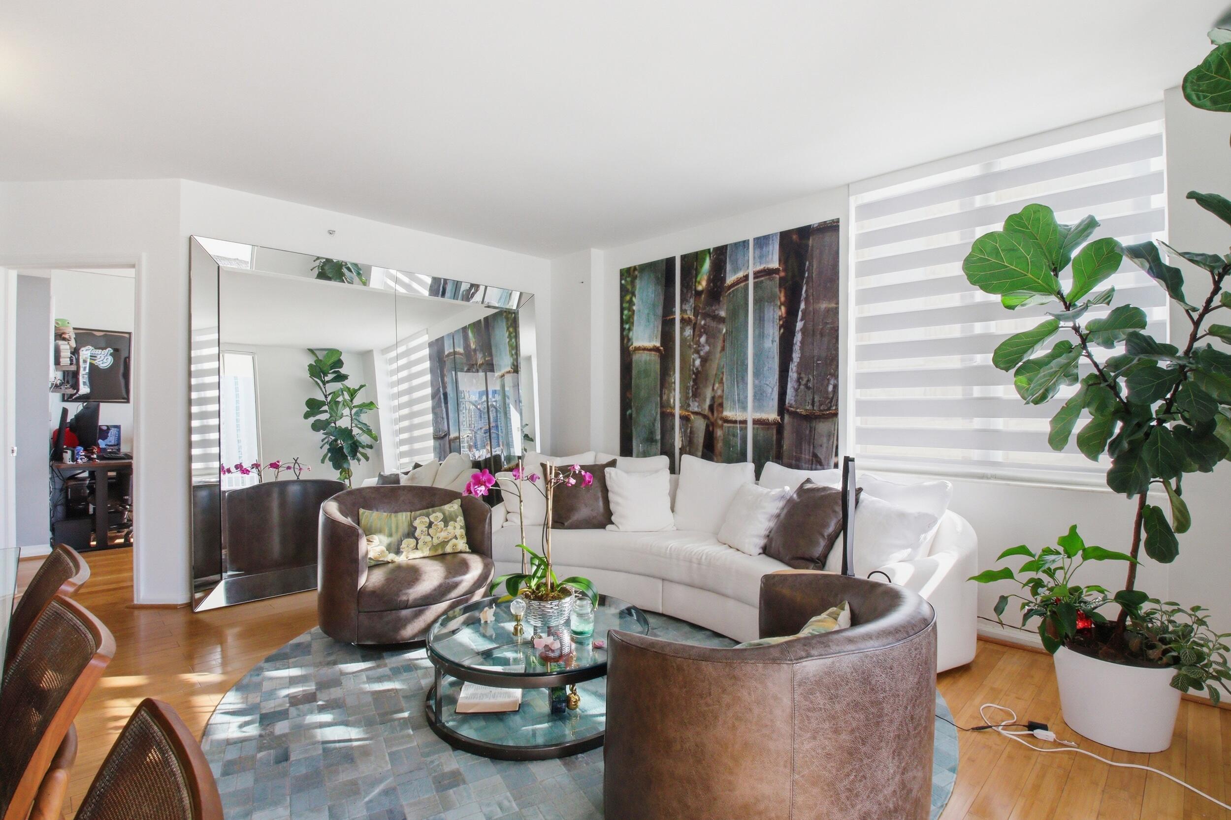 701 Brickell Key Boulevard, Unit 610 Miami, FL 33131 - Photo 12 of 40 a living room with furniture and flowers