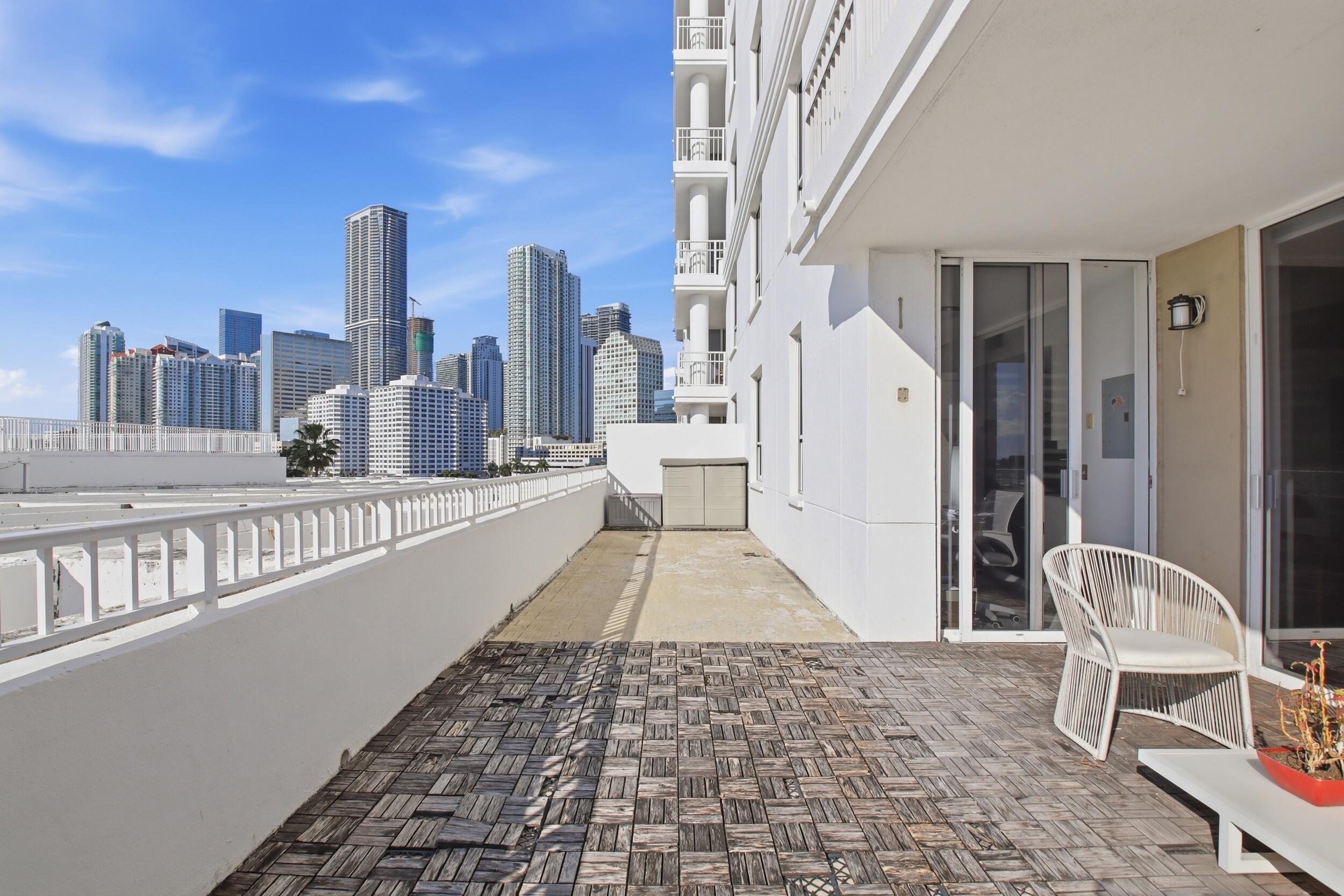 701 Brickell Key Boulevard, Unit 610 Miami, FL 33131 - Photo 20 of 40 a view of a balcony with chairs