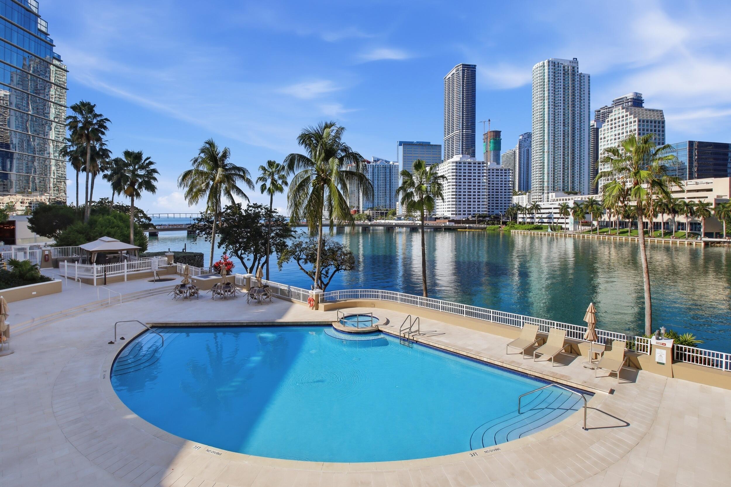 701 Brickell Key Boulevard, Unit 610 Miami, FL 33131 - Photo 30 of 40 a view of a swimming pool with outdoor seating