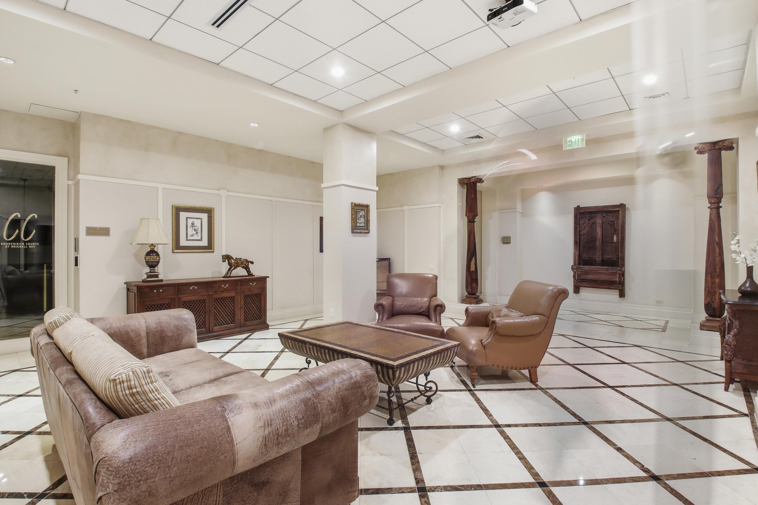 701 Brickell Key Boulevard, Unit 610 Miami, FL 33131 - Photo 34 of 40 a living room with furniture and a table