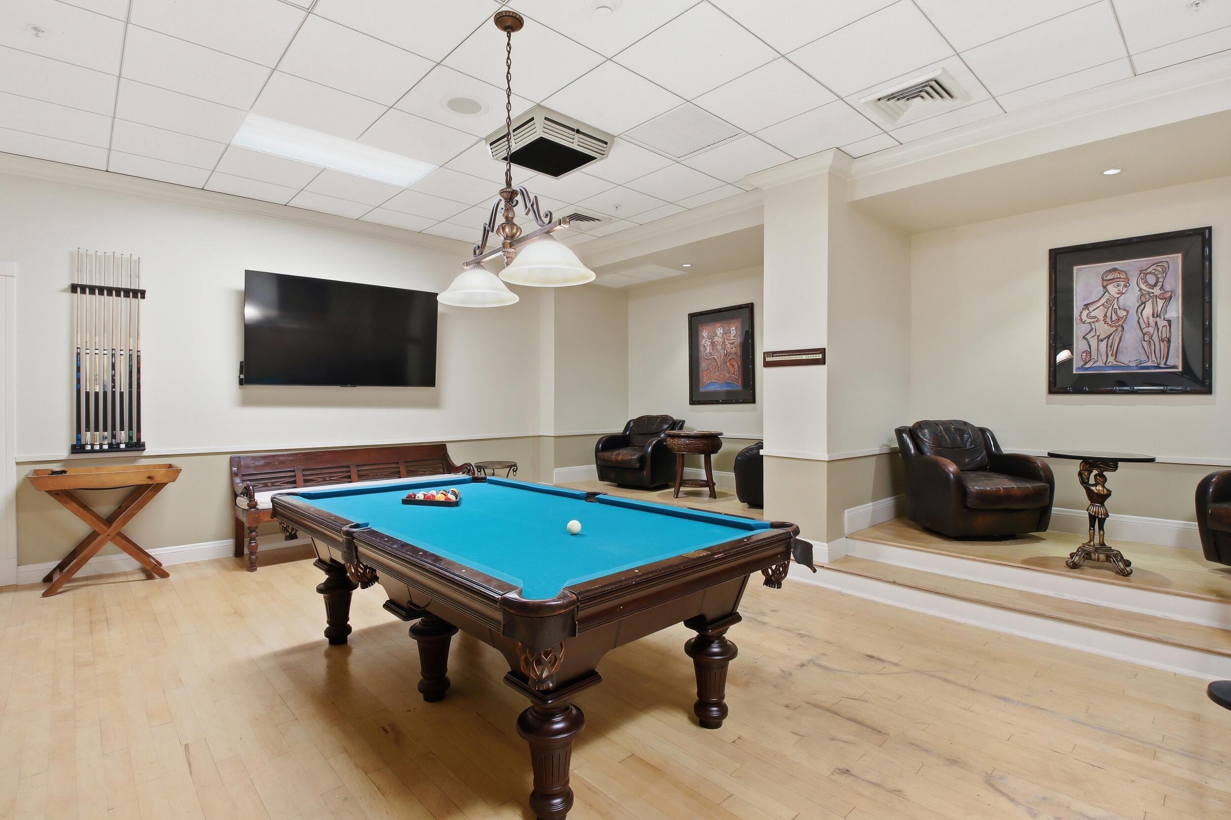 701 Brickell Key Boulevard, Unit 610 Miami, FL 33131 - Photo 35 of 40 a living room with furniture and a flat screen tv