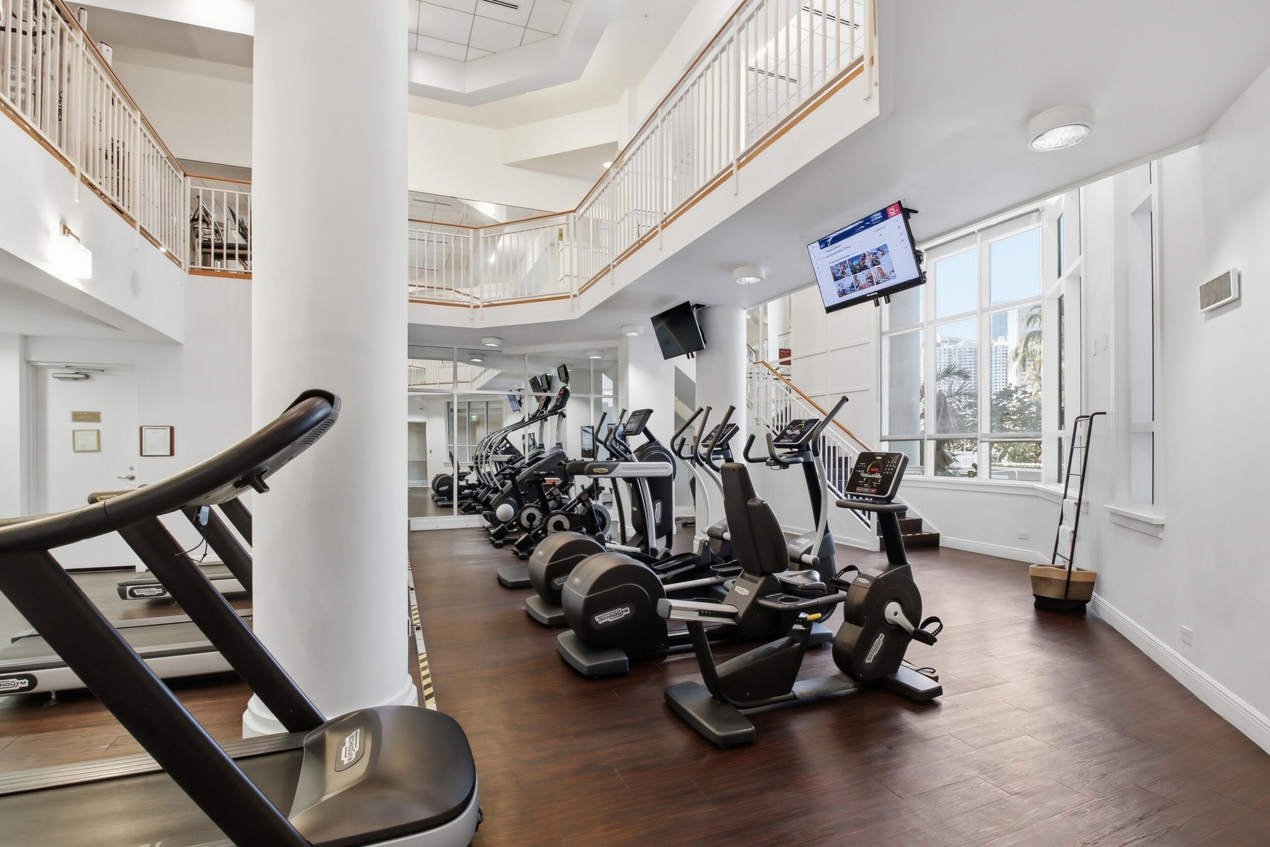 701 Brickell Key Boulevard, Unit 610 Miami, FL 33131 - Photo 36 of 40 a view of a room with gym equipment