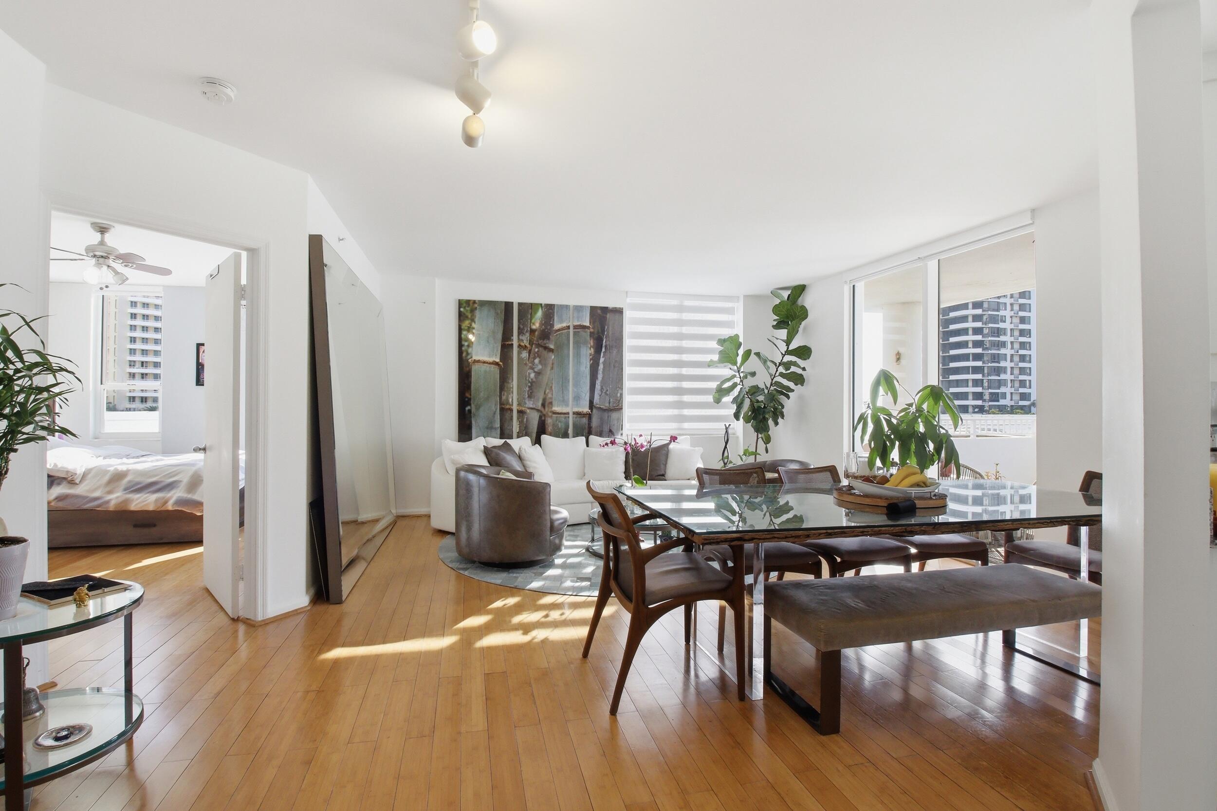 701 Brickell Key Boulevard, Unit 610 Miami, FL 33131 - Photo 9 of 40 a workspace with furniture window and wooden floor