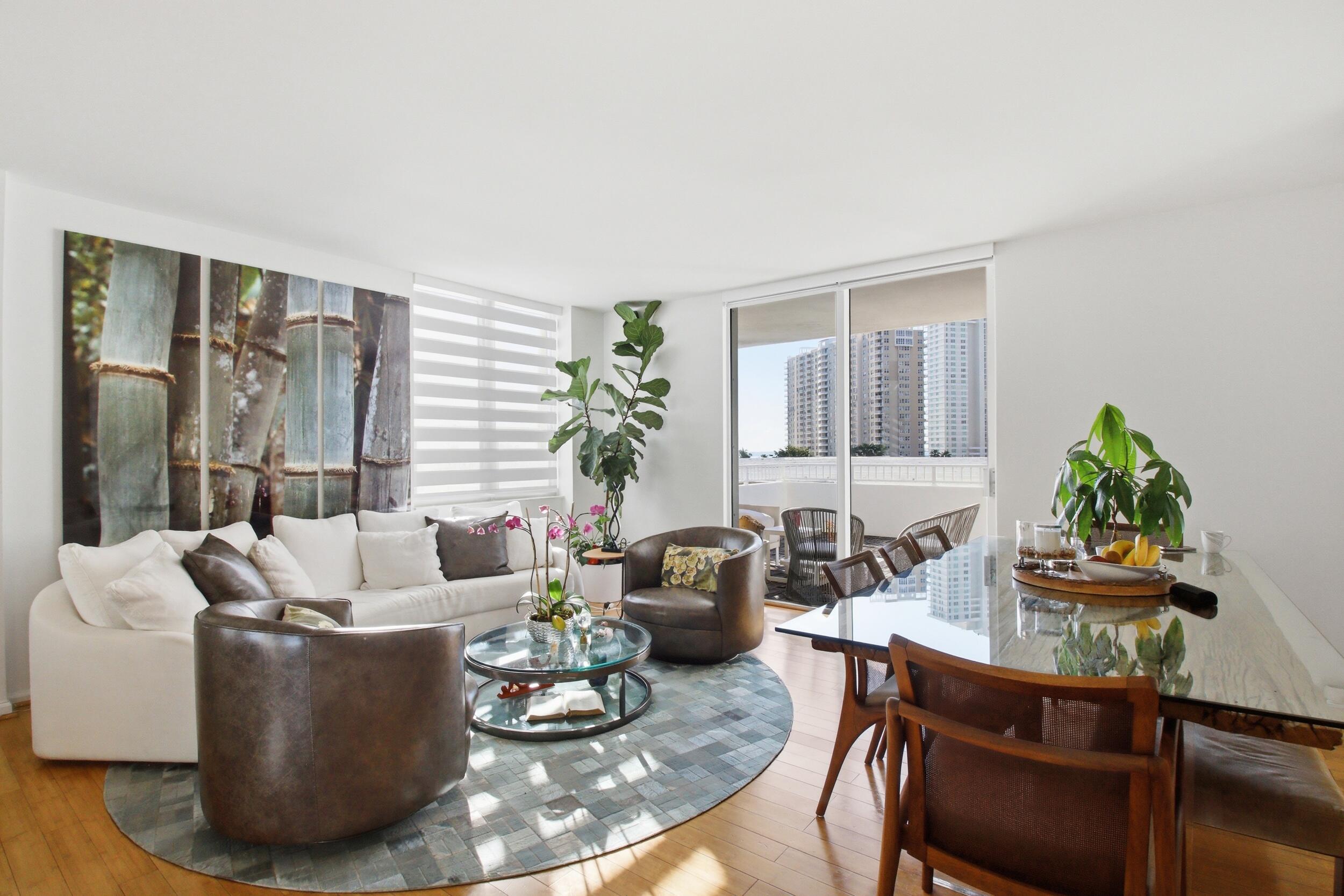 701 Brickell Key Boulevard, Unit 610 Miami, FL 33131 - Photo 10 of 40 a living room with furniture and a potted plant