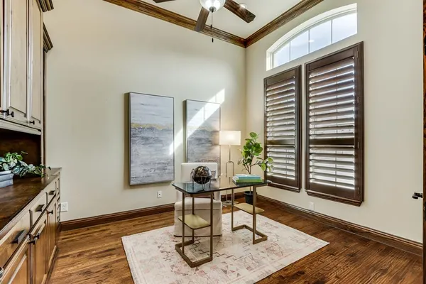 a work room with furniture and wooden floor