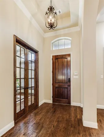 a view of an entryway with wooden floor